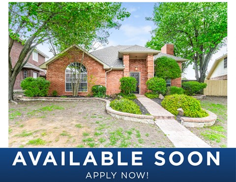 a home with a yard and trees and a driveway